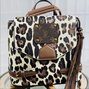 Authentic upcycled Lv cheetah backpack/crossbody